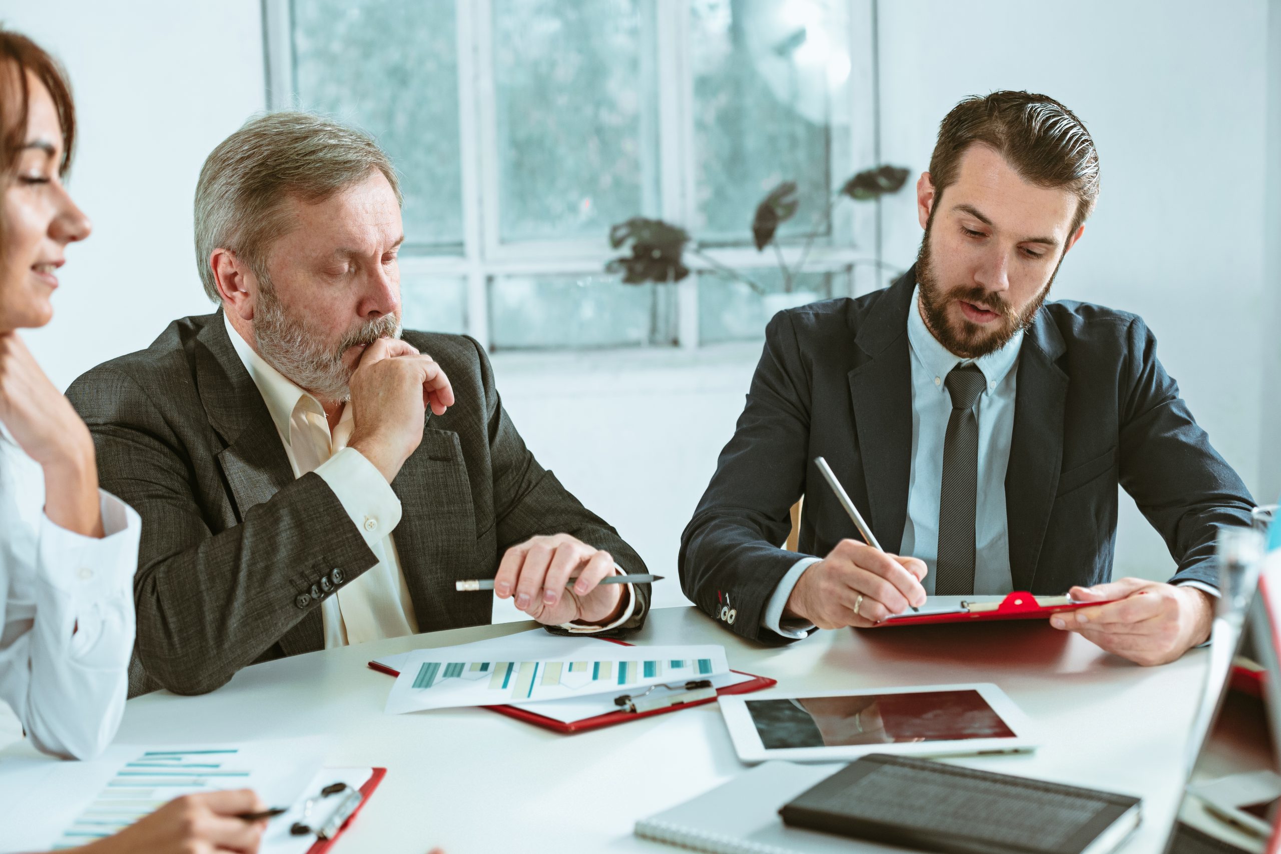 The business people working together at table. The meeting or summit concept